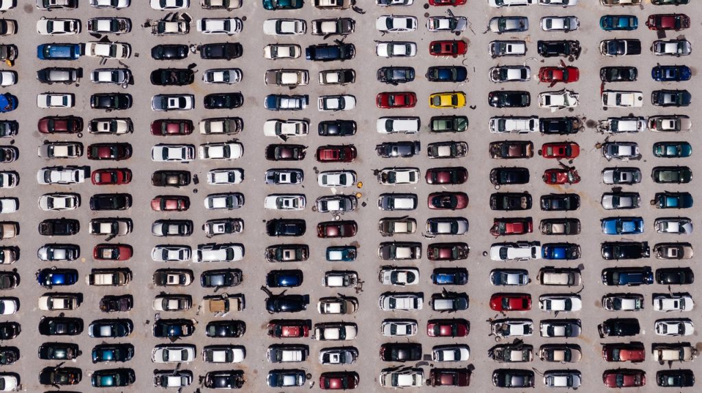 Cars-parking-lot-pexels-kelly-lacy-2402235-1024x574.jpg