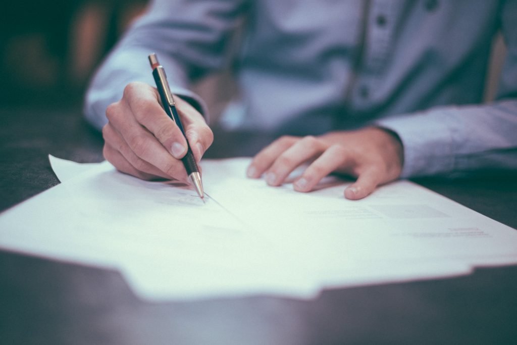 Paperwork-signing-scott-graham-OQMZwNd3ThU-unsplash-1024x683.jpg