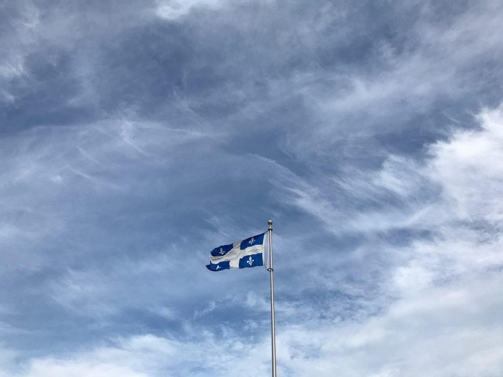 quebec-flag-adrien-olichon-D-b8riA56w4-unsplash-1024x768.jpg