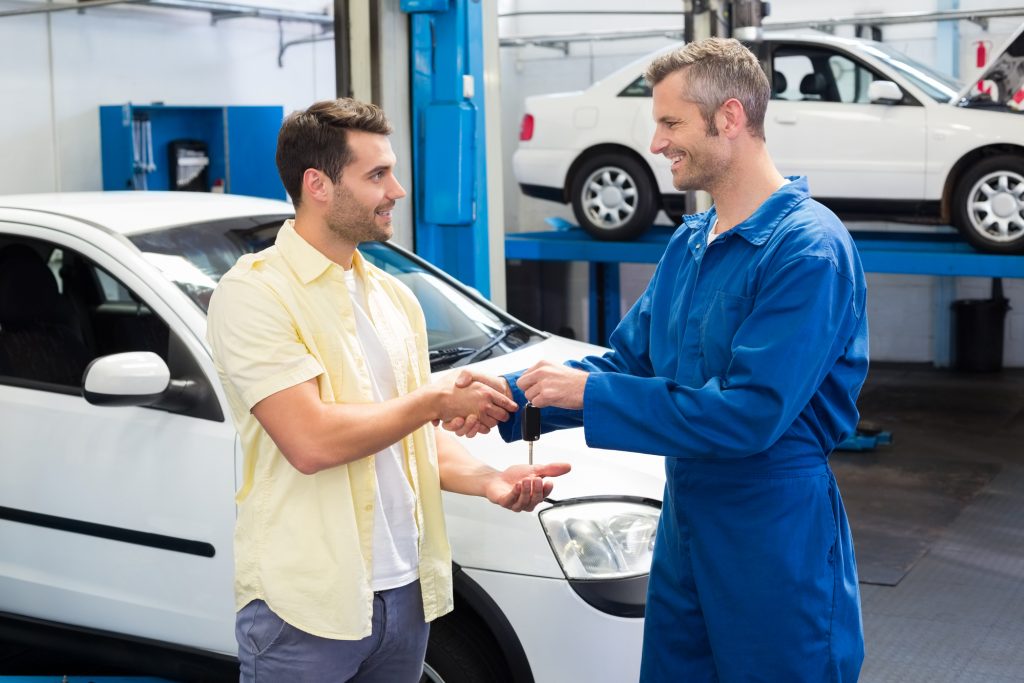 Happy-customer-service-advisor-technician-mechanic-shop-Depositphotos_65540881_L-1024x683.jpg