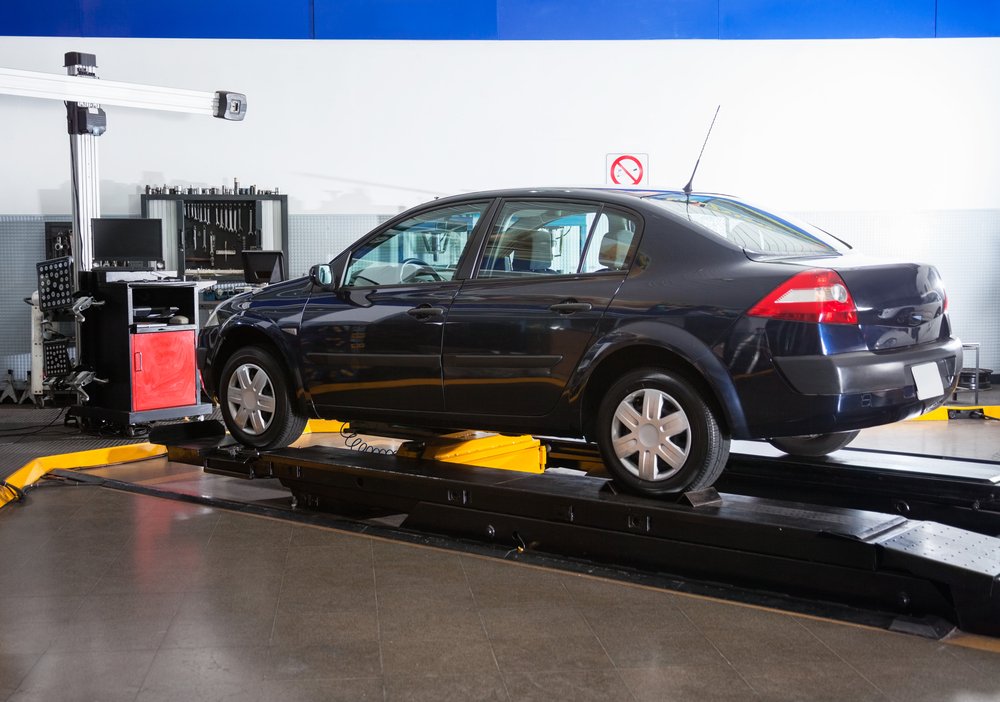 Car-hoist-lift-mechanic-technician-garage-shop-repair-Depositphotos_88987040_S.jpg