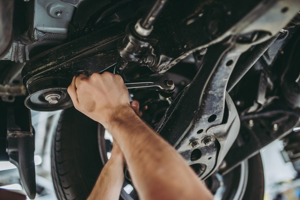 Technician-mechanic-repair-car-vehicle-garage-shop-Depositphotos_171626248_S.jpg