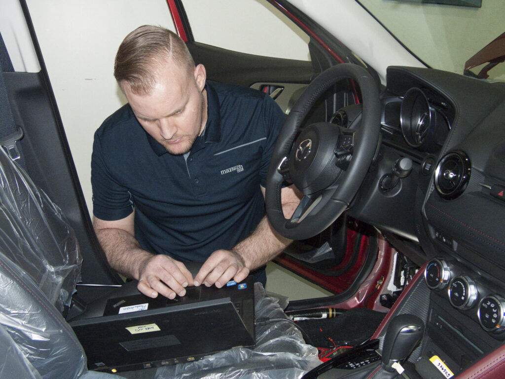 Jason Versteeg diagnoses a vehicle at the 2018 Canadian MazTech Service Skills Competition in Toronto.